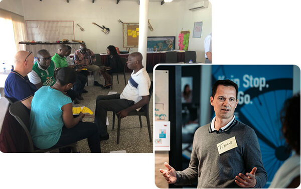 Gruppenfoto mit unseren Consultants und den Mitgliedern einer Organisation in Afrika | Kraus & Partner